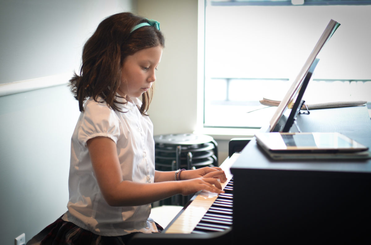 girl playing the piano