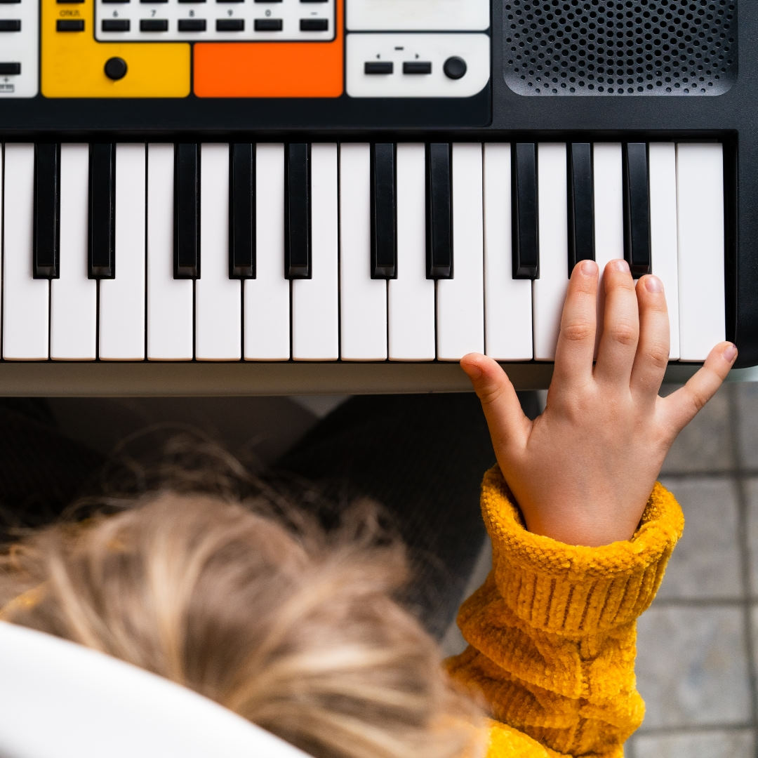 small child playing piano