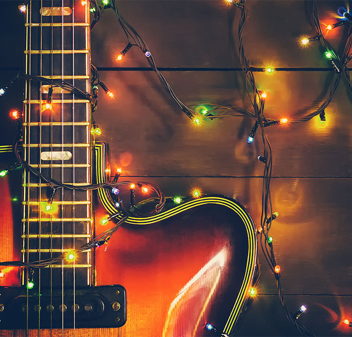 Christmas lights around guitar