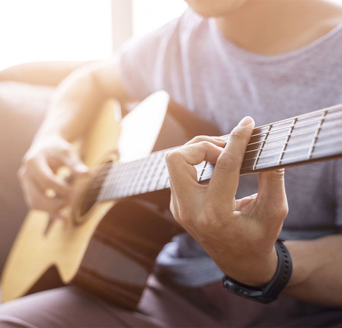 Man playing acoustic guitar