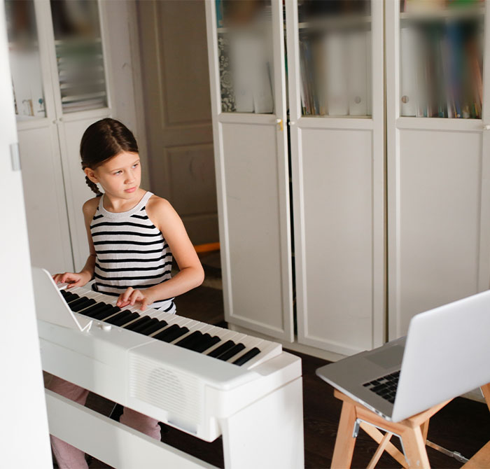 girl standing at keyboard