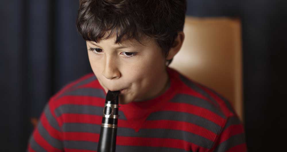 boy playing clarinet