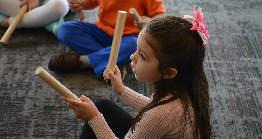 playing with percussion sticks