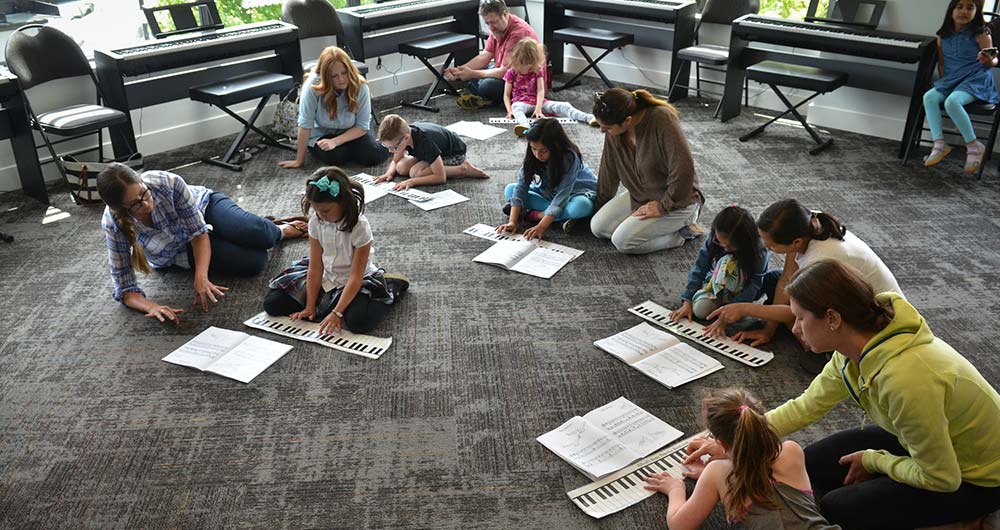 kids playing paper piano