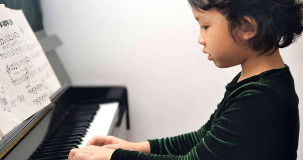 kid at the piano