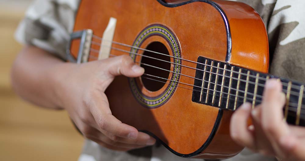 playing ukulele up close