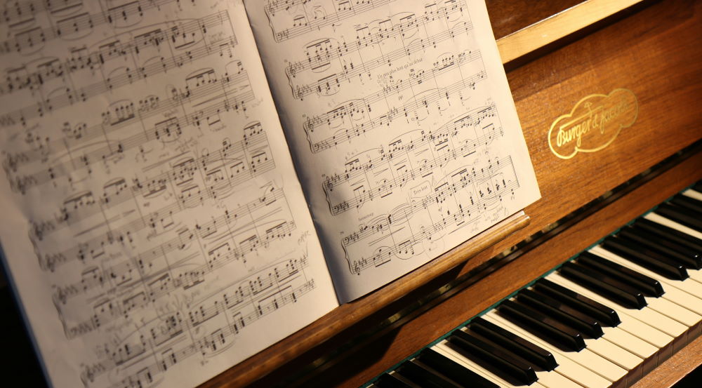 sheet music and piano