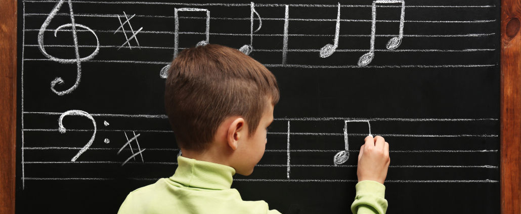 bow drawing notes on the chalkboard